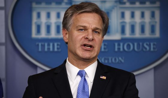 FBI Director Christopher Wray speaks during the daily press briefing at the White House, Thursday, Aug. 2, 2018, in Washington. (AP Photo/Evan Vucci) ** FILE **