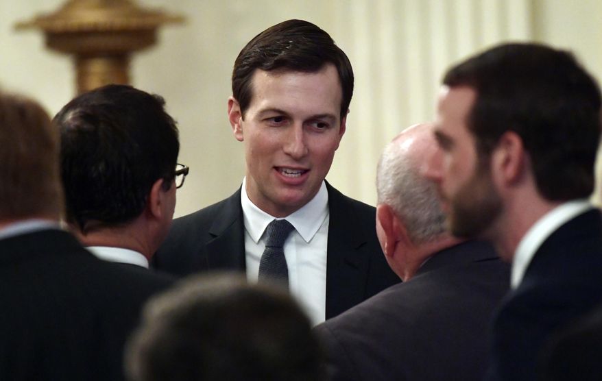 FILE - In this June 29, 2018, file photo, White House adviser Jared Kushner speaks with people as they wait for President Donald Trump to arrive to speak about taxes during an event in the East Room of the White House in Washington. U.S. officials say the Trump administration is staffing up a Middle East team at the White House in anticipation of rolling out its much-heralded but largely mysterious Israeli-Palestinian peace plan in the coming months. The National Security Council began last week to approach other agencies seeking volunteers to join the team, which will work for Trump’s Mideast peace pointmen Kushner and Jason Greenblatt, according to the officials. (AP Photo/Susan Walsh, File)