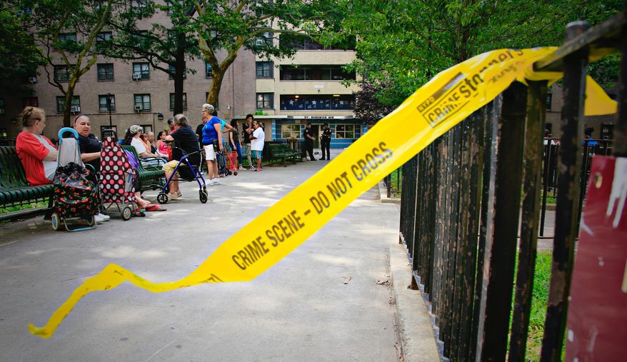 A broken crime scene tape blows in the wind as in the Brooklyn borough of New York, July 18, 2018. (AP Photo/Bebeto Matthews) FILE **
