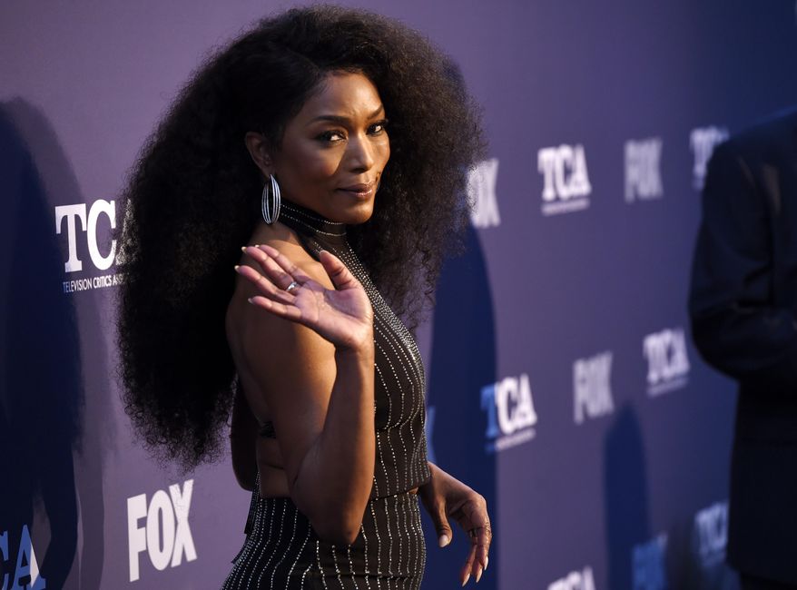 Angela Bassett, a cast member in the television series "9-1-1," waves to photographers at the FOX Summer TCA All-Star Party at Soho House West Hollywood, Thursday, Aug. 2, 2018, in West Hollywood, Calif. (Photo by Chris Pizzello/Invision/AP)