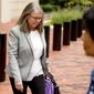 Tax preparer Cindy Laporta leaves the Alexandria Federal Courthouse in, Alexandria, Va., Friday, Aug. 3, 2018, on day four of President Donald Trump&#39;s former campaign chairman Paul Manafort&#39;s tax evasion and bank fraud trial. One of Manafort&#39;s tax preparers admitted Friday that she helped disguise $900,000 in foreign income as a loan in order to reduce the former Trump campaign chairman&#39;s tax burden. (AP Photo/Andrew Harnik)