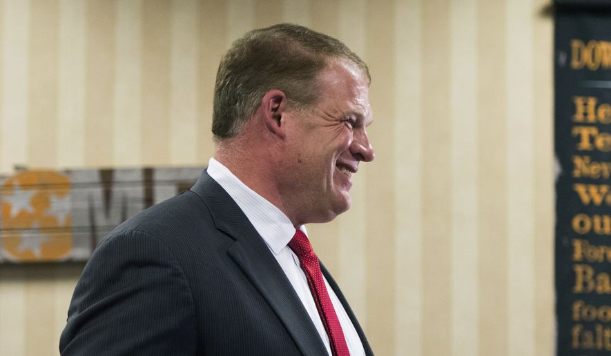 Republican Glenn Jacobs reacts to early results predicting him as Knox County mayor Thursday, Aug. 2, 2018, in Knoxville, Tenn. Jacobs, who is also the WWE wrestler known as Kane, defeated Democrat Linda Haney. (Caitie McMekin/Knoxville News Sentinel via AP)
