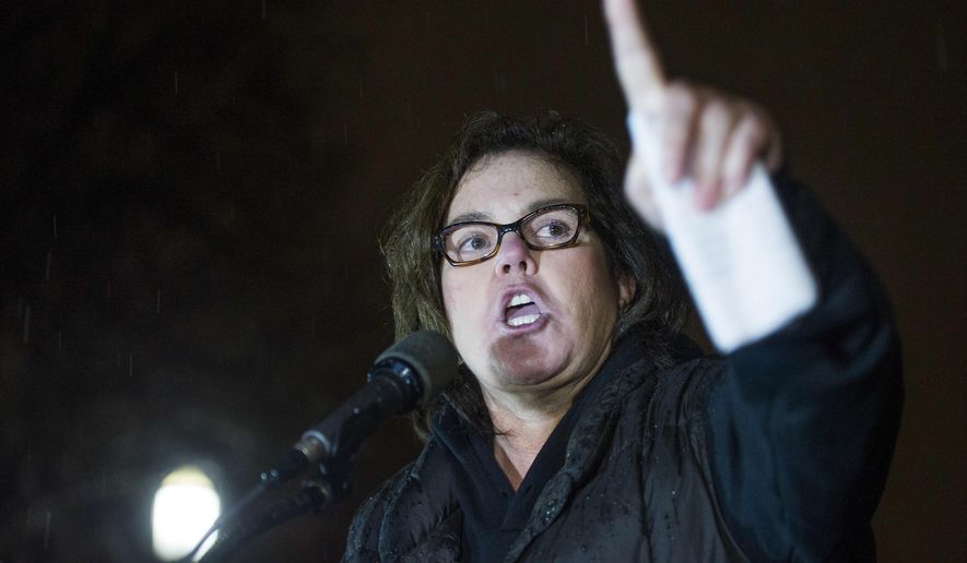 FILE - In this Feb. 28, 2017 file photo, Rosie O'Donnell speaks at a rally calling for resistance to President Donald Trump in Lafayette Park in front of the White House in Washington. O’Donnell and cast members from some of Broadway’s biggest musicals plan to serenade President Donald Trump on Monday, Aug. 6, 2018, but from outside the White House in protest. The group will sing “The People's Song” from “Les Miserables,” Burt Bacharach’s “What the World Needs Now Is Love,” “A Brand New Day” from “The Wiz” and “Climb Ev'ry Mountain” from “The Sound of Music” from Lafayette Park. (AP Photo/Cliff Owen, File)