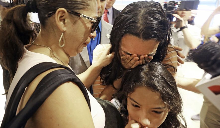 Alejandra Juarez, 39, left, says goodbye to her children, Pamela and Estela at the Orlando International Airport on Friday, Aug. 3, 2018, in Orlando, Fla. Juarez, the wife of a former Marine is preparing to self-deport to Mexico in a move that would split up their family. (Red Huber/Orlando Sentinel via AP) ** FILE **