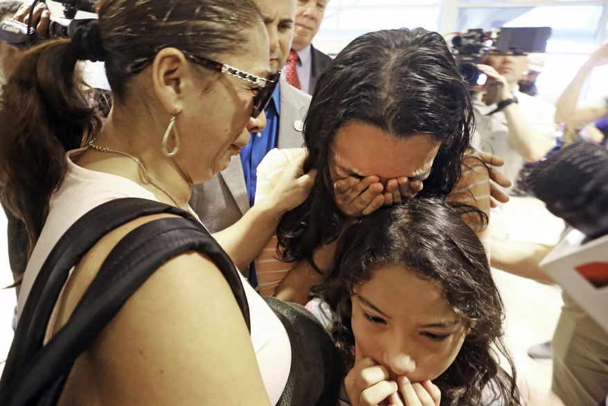 Alejandra Juarez, 39, left, says goodbye to her children, Pamela and Estela at the Orlando International Airport on Friday, Aug. 3, 2018, in Orlando, Fla.  Juarez, the wife of a former Marine is preparing to self-deport to Mexico in a move that would split up their family. (Red Huber/Orlando Sentinel via AP) ** FILE **