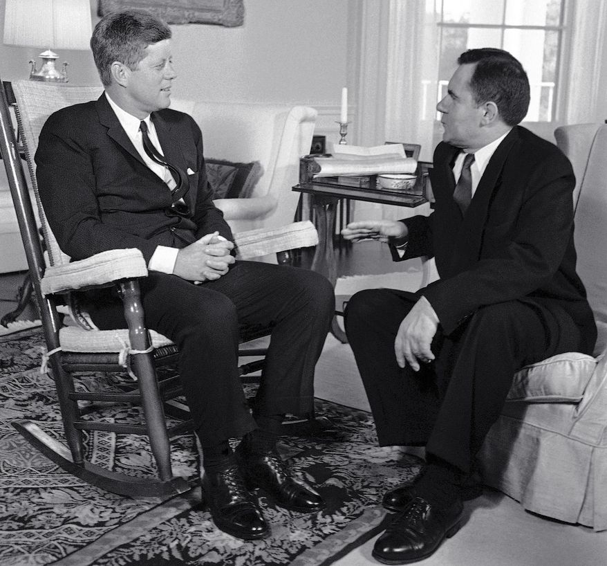 FILE - In this Oct. 6, 1961, file photo, President John F. Kennedy, left, sits in his rocker in the White House in Washington, as he talks with Soviet Foreign Minister Andrei Gromyko about the Berlin situation. Beginning Friday, Aug. 3, 2018, Eldred's auction gallery in East Dennis, Mass., on Cape Cod, is auctioning items associated with the late president, including a rocking chair that Kennedy used in the White House. (AP Photo/Bob Schutz, File)