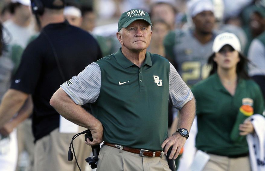 FILE - In this Sept. 10, 2016, file photo, Baylor acting coach Jim Grobe watches from the sideline during the second half of the team's NCAA college football game against SMU in Waco, Texas. Grobe, a former Wake Forest coach, came out of retirement to lead Baylor after Art Briles was fired following a sexual abuse scandal at the school. Grobe led the team to a 6-6 regular-season finish and a spot in the Cactus Bowl. The Bears defeated favored Boise State 31-12 to give the Bears a winning season. Grobe steadfastly said he had no interest in returning for another year and he headed back into retirement. (AP Photo/LM Otero, File)