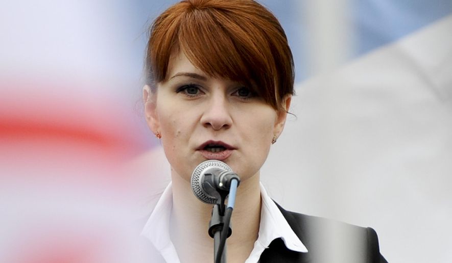 In this Sunday, April 21, 2013, photo, Maria Butina, leader of a pro-gun organization in Russia, speaks to a crowd during a rally in support of legalizing the possession of handguns in Moscow, Russia. Moscow claims that a Russian woman arrested in the United States on charges of acting as an unregistered foreign agent for Russia is being mistreated in jail. Russian Foreign Ministry spokeswoman Maria Zakharova told reporters Friday, Aug. 3, 2018 that Maria Butina is being kept in solitary confinement in a cold sell.  (AP Photo, file)
