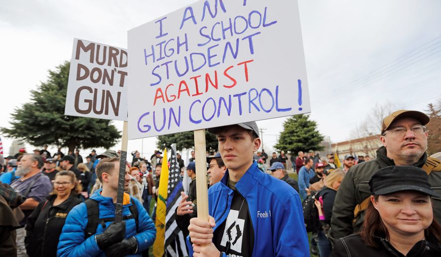 Levi Rodas, 16, and other students at Orem High School in Utah showed his support for gun rights in a rally this year, but gun control rallies at public schools across the nation generate much more attention. (Associated Press/File)