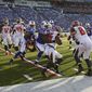 Tampa Bay Buccaneers kick returner Solomon Patton (86) is stopped by Kenny Ladler (31) during the second half of a preseason NFL football game against the Buffalo Bills Saturday, Aug. 23, 2014, in Orchard Park, N.Y. (AP Photo/Bill Wippert)
