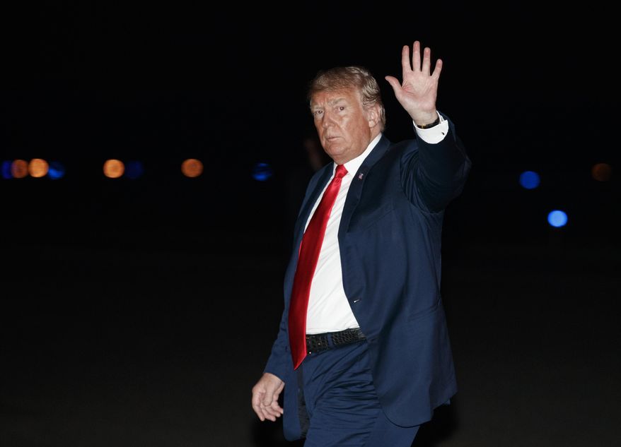 President Donald Trump waves as he arrives on Air Force One at Morristown Municipal Airport, in Morristown, N.J., Saturday, Aug. 4, 2018, en route to Trump National Golf Club in Bedminster, N.J., after attending a rally in Lewis Center, Ohio. (AP Photo/Carolyn Kaster)