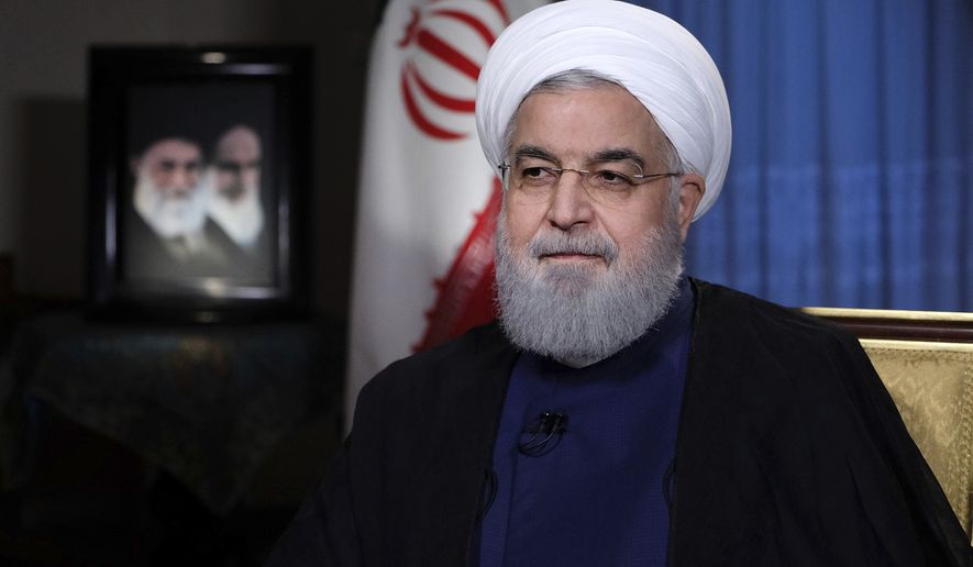 In this photo released by official website of the office of the Iranian Presidency, President Hassan Rouhani addresses the nation in a televised speech in Tehran, Iran, Monday, Aug. 6, 2018. Iranian President Hassan Rouhani struck a hard line Monday as the U.S. restored some sanctions that had been lifted under the 2015 nuclear deal. (Iranian Presidency Office via AP)