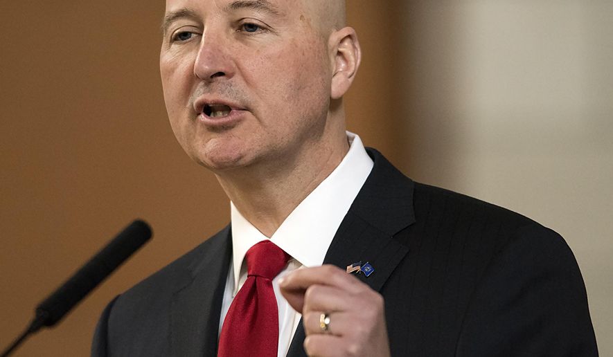 FILE - In this April 18, 2018, file photo, Nebraska Gov. Pete Ricketts speaks at the legislature, in Lincoln, Neb. Pope Francis' decree that the death penalty is "inadmissible" in all cases could pose a dilemma for Roman Catholic politicians and judges in the United States. Ricketts, a Republican and Catholic who worked to reinstate capital punishment in his state after lawmakers abolished it in 2015, said the pope's decree doesn't change his stance. (Gwyneth Roberts/Lincoln Journal Star via AP, File)