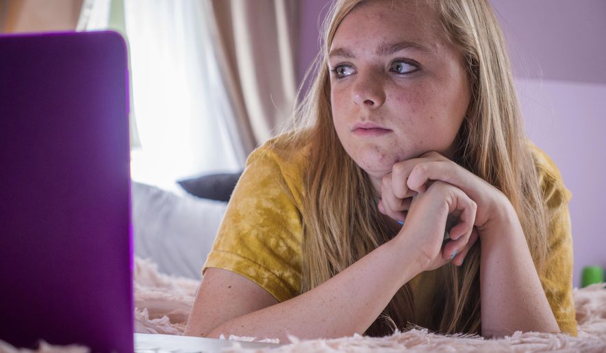 This image released by A24 shows Elsie Fisher in a scene from "Eighth Grade." Actual 8th graders will be able to see the R-rated coming-of-age movie “Eighth Grade” in select movie theaters across the nation Wednesday. The film’s distributor A24 says Monday, Aug. 6, that it’s hosting a night of free screenings in every state on August 8 and waving the R-rating to allow kids of all ages to experience the film. There is at least one participating theater in each state. (Linda Kallerus/A24 via AP)