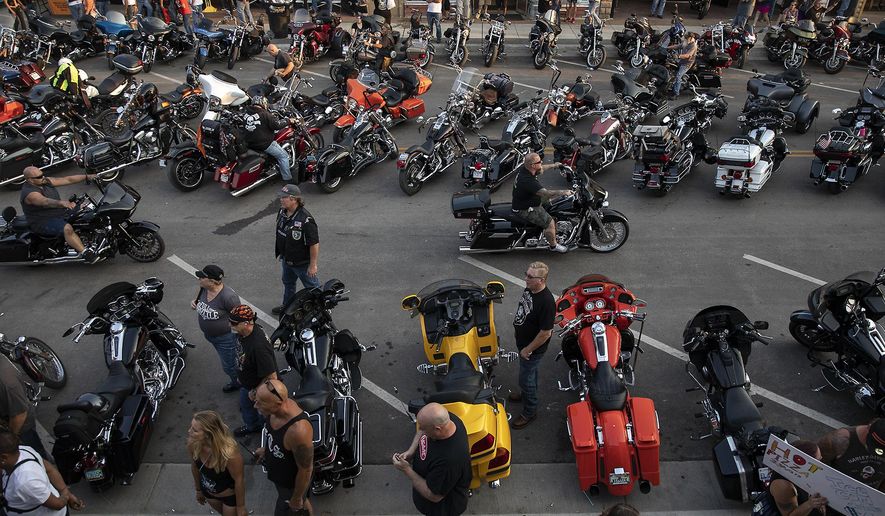 In this Saturday, Aug 4, 2018 photo, motorcycles fill Main Street in downtown Sturgis, S.D., during the 78th annual Sturgis Motorcycle Rally. (Ryan Hermens/Rapid City Journal via AP)