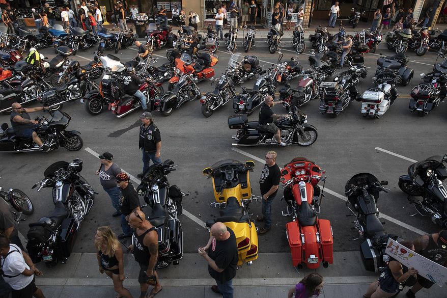 In this Saturday, Aug 4, 2018 photo, motorcycles fill Main Street in downtown Sturgis, S.D., during the 78th annual Sturgis Motorcycle Rally. (Ryan Hermens/Rapid City Journal via AP)