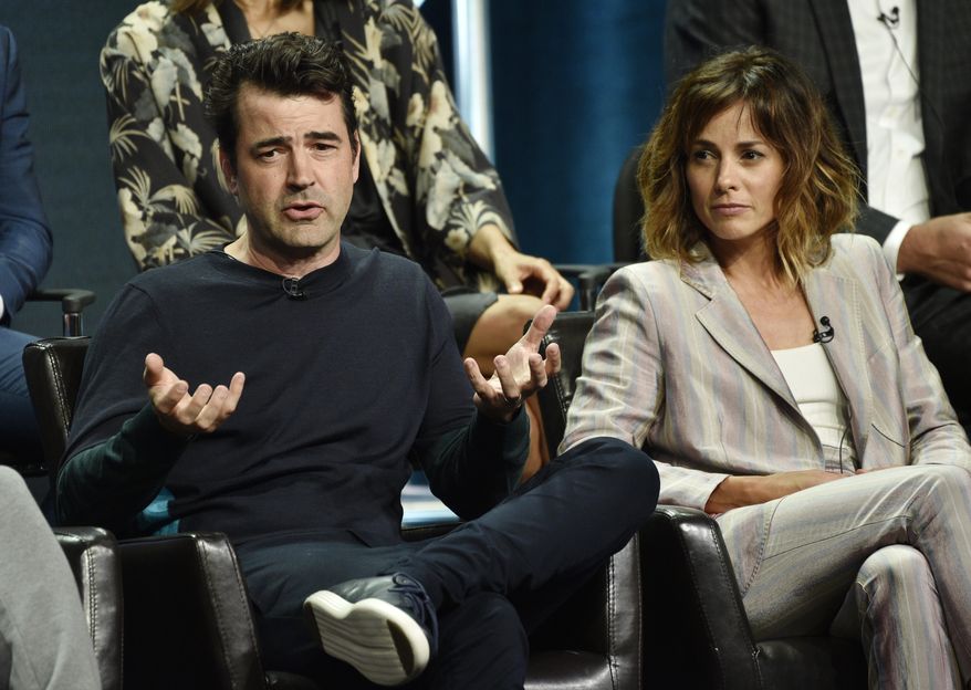 Ron Livingston, left, a cast member in the Disney ABC television series "A Million Little Things," answers a question as fellow cast member Stephanie Szostak looks on during the 2018 Television Critics Association Summer Press Tour, Tuesday, Aug. 7, 2018, in Beverly Hills, Calif. (Photo by Chris Pizzello/Invision/AP)
