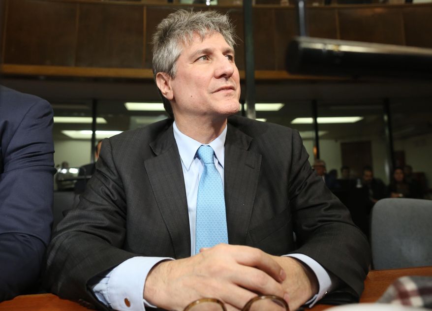 Former Argentine Vice President Amado Boudou sits in a courtroom during the verdict of the trial against him in Buenos Aires, Argentina, Tuesday, Aug. 7, 2018. Boudou was sentenced to five years and 10 months in prison for bribery and conducting business incompatible with public office. (AP Photo/Sebastian Pani)