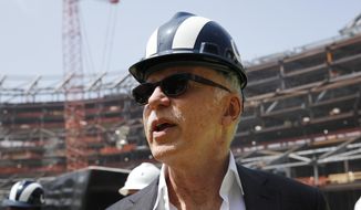 FILE - In this file photo dated Thursday, June 14, 2018, Los Angeles Rams owner Stan Kroenke tours the team&#39;s new NFL football stadium, in Inglewood, Calif. USA.  In a statement published Tuesday Aug. 7, 2018, majority shareholder Kroenke has made an offer to take full ownership of England&#39;s Arsenal soccer club in a deal that would value the Premier League club at 1.8 billion pounds (US dollars 2.3 billion). (AP Photo/Jae C. Hong)