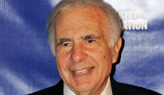FILE - In this March 16, 2010, file photo, financier Carl Icahn poses for photos upon arriving for the annual New York City Police Foundation Gala in New York. Icahn is urging Cigna shareholders to vote against the health insurer’s attempted multi-billion dollar takeover of Express Scripts. In a letter Tuesday, Aug. 7, 2018, Icahn warned that Express Scripts, a pharmacy benefit manager, faces intense competition from Amazon, regulatory risks and could lose the business of other health insurers that won’t want to deal with a company owned by a rival. (AP Photo/Henny Ray Abrams, File)