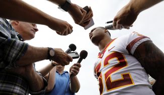 Iowa State running back David Montgomery, right, speaks to reporters during Iowa State&#39;s annual NCAA college football media day, Tuesday, Aug. 7, 2018, in Ames, Iowa. (AP Photo/Charlie Neibergall)