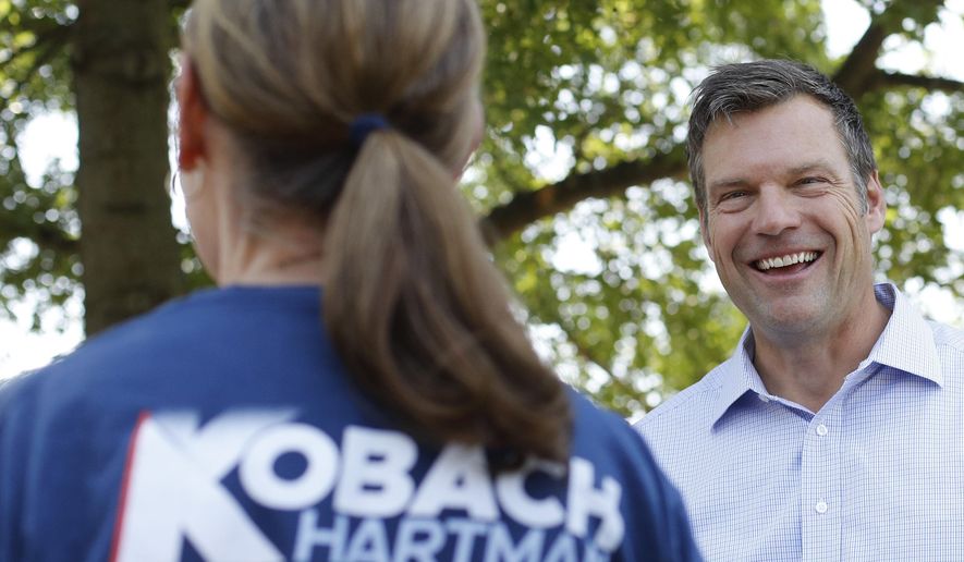 Kansas Secretary of State and candidate for the Republican nomination for Kansas Governor Kris Kobach addresses supporters during a campaign stop Friday, Aug. 3, 2018, in Pittsburg, Kan. (AP Photo/Charlie Riedel)