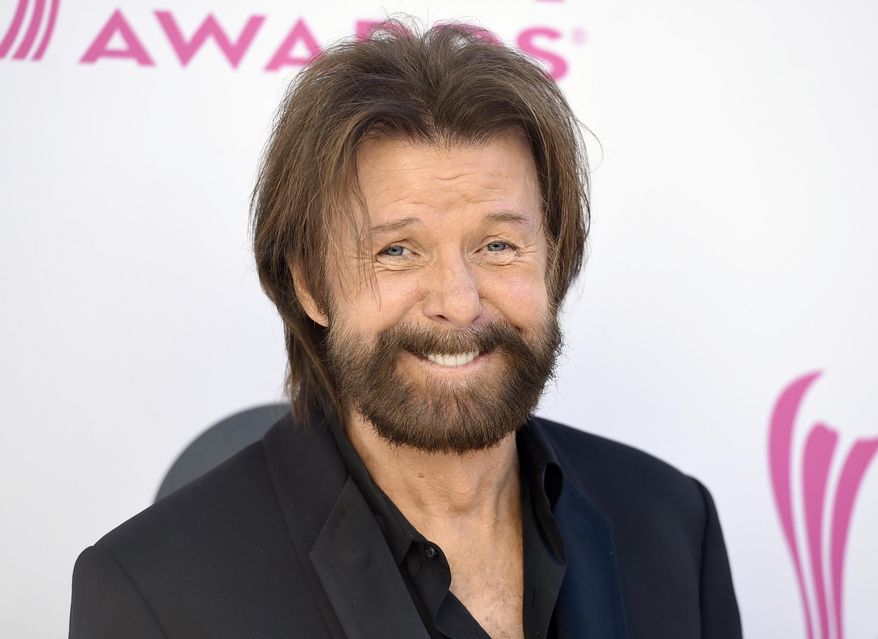 FILE - In this Sunday, April 2, 2017, file photo, Ronnie Dunn, of Brooks & Dunn, arrives at the 52nd annual Academy of Country Music Awards at the T-Mobile Arena in Las Vegas. Dunn and singer-songwriter K.T. Oslin will join the Nashville Songwriters Hall of Fame this year, the organization announced Tuesday, Aug. 7, 2018. (Photo by Jordan Strauss/Invision/AP, File)