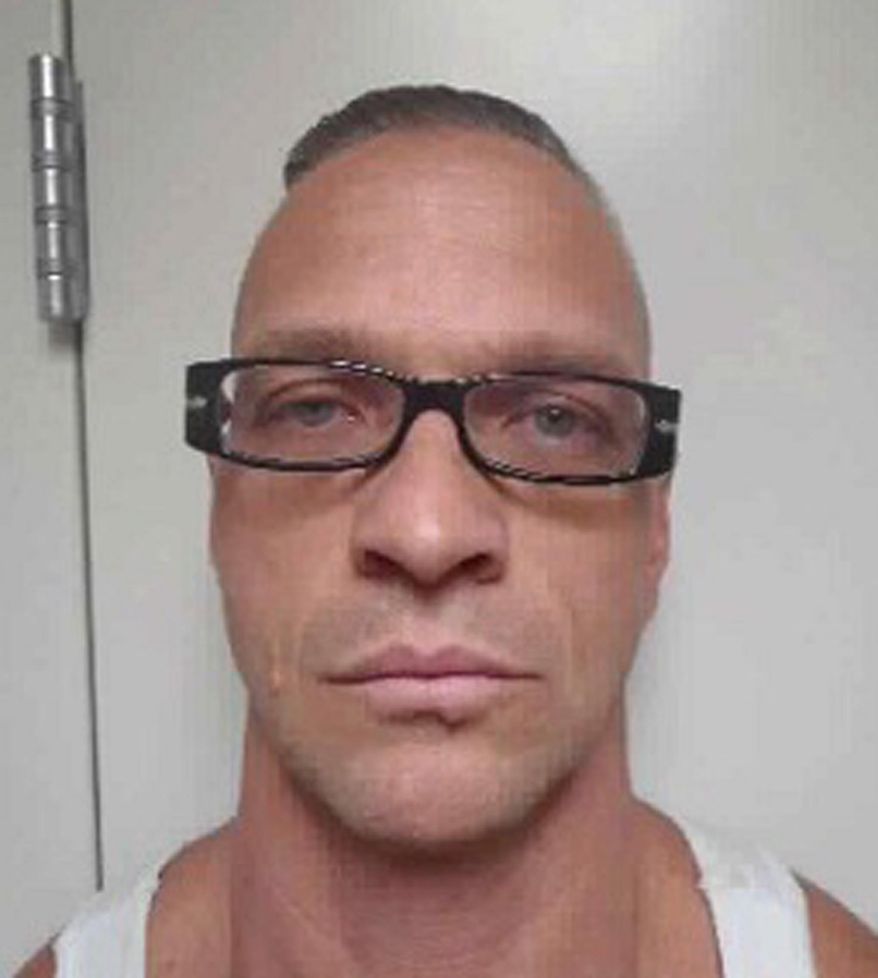 FILE - This undated file photo provided by Nevada Department of Corrections photo shows death row inmate Scott Raymond Dozier, who was convicted in 2007 of robbing, killing and dismembering a 22-year-old man in Las Vegas, and was convicted in Arizona in 2005 of another murder and dismemberment near Phoenix. Fifteen states are siding with Nevada as it fights drug companies battling the use of their products in an inmate's execution. In what a national death penalty expert on Tuesday, Aug. 7, 2018, called a setup for a showdown, documents filed with the Nevada Supreme Court argue that drug company Alvogen's effort to block the use of its sedative midazolam in the stalled execution of Dozier in Nevada is part of a "guerrilla war against the death penalty." (Nevada Department of Corrections via AP, File)