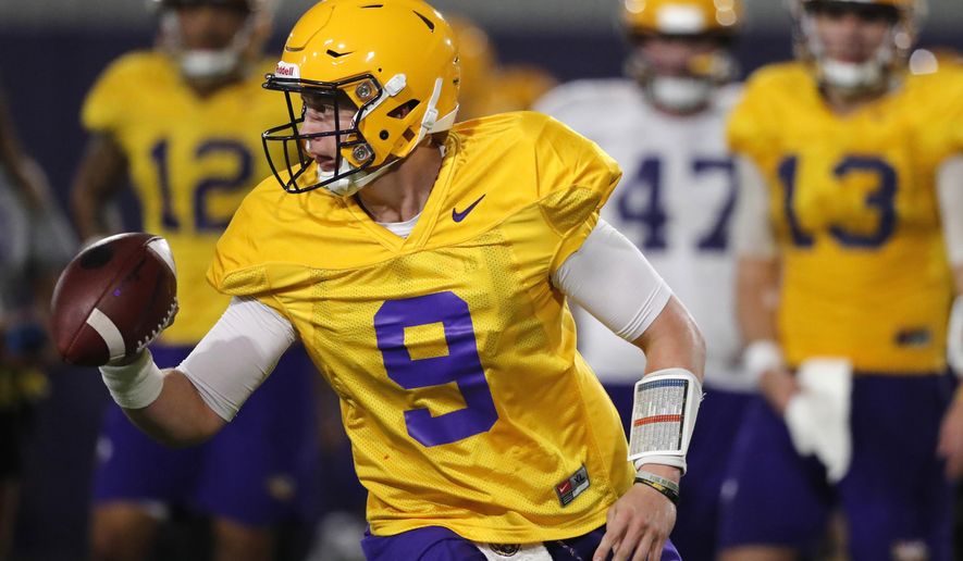 LSU quarterback Joe Burrow (9) runs through drills during their NCAA college football practice in Baton Rouge, La., Monday, Aug. 6, 2018. The former Ohio State quarterback played behind the dynamic J.T. Barrett for two seasons. Burrow will compete for a starting job with the Tigers, who are installing a spread attack under new offensive coordinator Steve Ensminger. (AP Photo/Gerald Herbert)