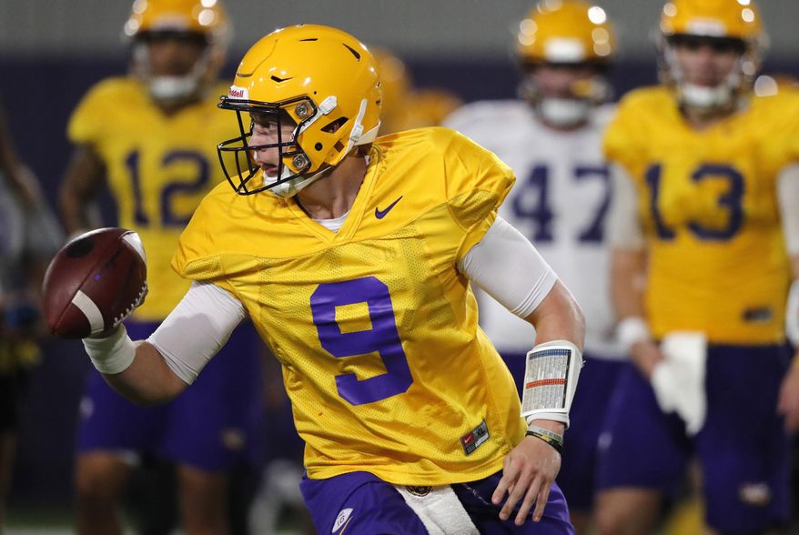 LSU quarterback Joe Burrow (9) runs through drills during their NCAA college football practice in Baton Rouge, La., Monday, Aug. 6, 2018. The former Ohio State quarterback played behind the dynamic J.T. Barrett for two seasons. Burrow will compete for a starting job with the Tigers, who are installing a spread attack under new offensive coordinator Steve Ensminger. (AP Photo/Gerald Herbert)
