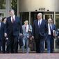 The defense team for Paul Manafort, including Kevin Downing, front left, Thomas Zehnle, front right, and Jay Nanavati, back row second from right, arrive at federal court for the continuation of the trial of the former Trump campaign chairman, in Alexandria, Va., Wednesday, Aug. 8, 2018. (AP Photo/Jacquelyn Martin)