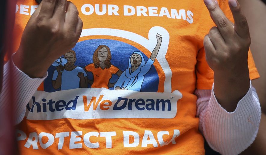 United We Dream youths and allies snap their fingers to show support to other DACA recipients speaking to the media after a court hearing in lawsuit filed by states challenging DACA program at the United States District Courthouse on Wednesday, Aug. 8, 2018, in Houston. (Yi-Chin Lee/Houston Chronicle via AP) ** FILE **
