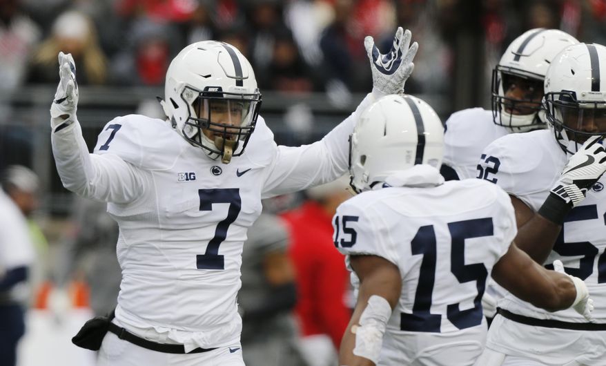 FILE - In this Oct. 28, 2017, file photo, Penn State linebacker Koa Farmer (7) celebrates recovering a fumble against Ohio State during the first half of an NCAA college football game in Columbus, Ohio. Farmer has always been a big fan of TV crime dramas. After he is done playing football, Farmer wants in on the action, for real. The senior is a criminology and sociology major at Penn State. (AP Photo/Jay LaPrete, File)