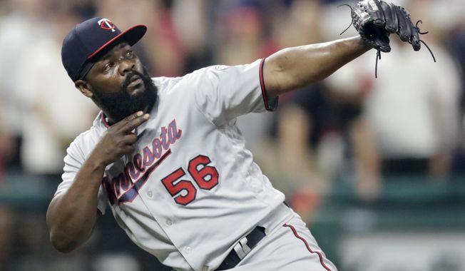Minnesota Twins relief pitcher Fernando Rodney celebrates after the Twins defeated the Cleveland Indians 3-2 in a baseball game Wednesday, Aug. 8, 2018, in Cleveland. (AP Photo/Tony Dejak)
