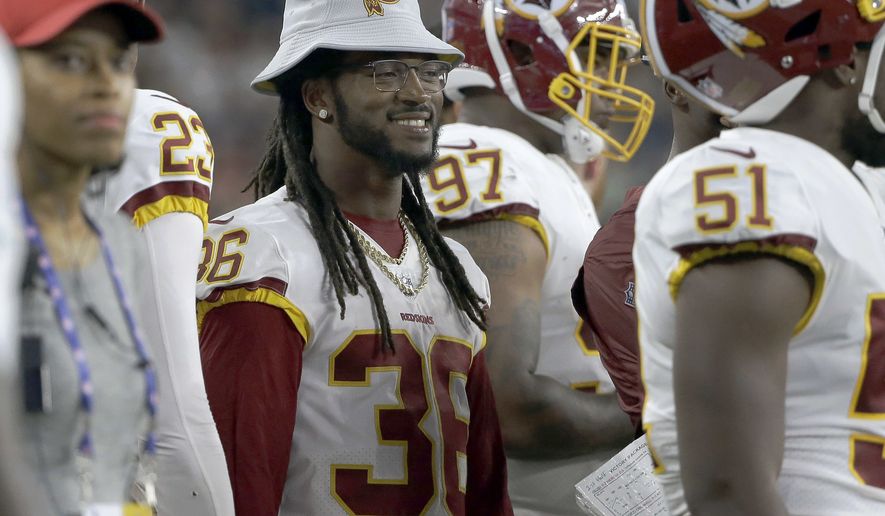 Washington Redskins defensive back D.J. Swearinger (36) watches from the sideline during the first half of a preseason NFL football game against the New England Patriots, Thursday, Aug. 9, 2018, in Foxborough, Mass. (AP Photo/Steven Senne)