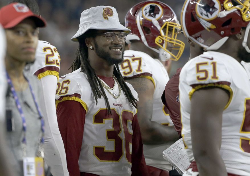 Washington Redskins defensive back D.J. Swearinger (36) watches from the sideline during the first half of a preseason NFL football game against the New England Patriots, Thursday, Aug. 9, 2018, in Foxborough, Mass. (AP Photo/Steven Senne)