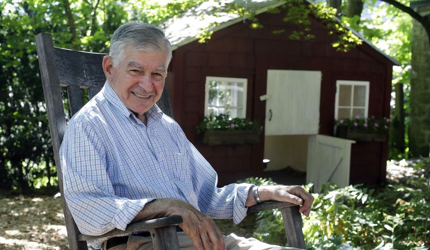 In this Thursday, Aug. 2, 2018 photo former Massachusetts governor and onetime Democratic presidential candidate Michael Dukakis sits for a photograph at his home, in Brookline, Mass. The 84-year-old Dukakis recently co-founded the Boston-based Artificial Intelligence World Society. The organization is pushing to have the United Nations pursue an international agreement to assure AI is used for constructive purposes only. (AP Photo/Steven Senne)