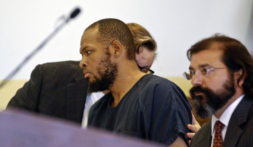 Siraj Ibn Wahhaj, center, confers with one of his attorneys at a first appearance in New Mexico district court in Taos, N.M., on Wednesday, Aug. 8, 2018, on accusations of child abuse and abducting his son from the boy's mother. (AP Photo/Morgan Lee) ** FILE **