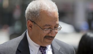 FILE- In this June 21, 2016, file photo, Rep. Chaka Fattah, D-Pa., walks after leaving the federal courthouse in Philadelphia.  A federal appeals court has overturned the ex-Pennsylvania congressman&#39;s bribery convictions, but has let stand guilty verdicts on numerous other counts. The 3rd U.S. Circuit Court of Appeals ruled Thursday, Aug. 9, 2018,  that Fattah, who is serving a 10-year prison sentence, and an associate are eligible for a retrial on the charges it threw out.  (AP Photo/Matt Rourke, File)