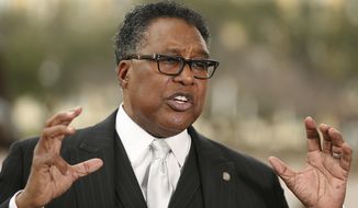 In this Feb. 19, 2018 photo, Dallas City council member Dwaine Caraway, of District 4, speaks during a news conference calling for the National Rifle Association to be disinvited from hosting the 2018 NRA Annual Meeting in Dallas while Caraway was outside Dallas City Hall in Dallas. Federal prosecutors said Caraway accepted more than $450,000 in kickbacks and bribes, in part through gambling money, trips to Las Vegas and other cities, and a phony consulting agreement. Court documents filed Thursday, Aug. 9, show Caraway pleaded guilty to wire fraud and tax evasion. (Andy Jacobsohn/The Dallas Morning News via AP)