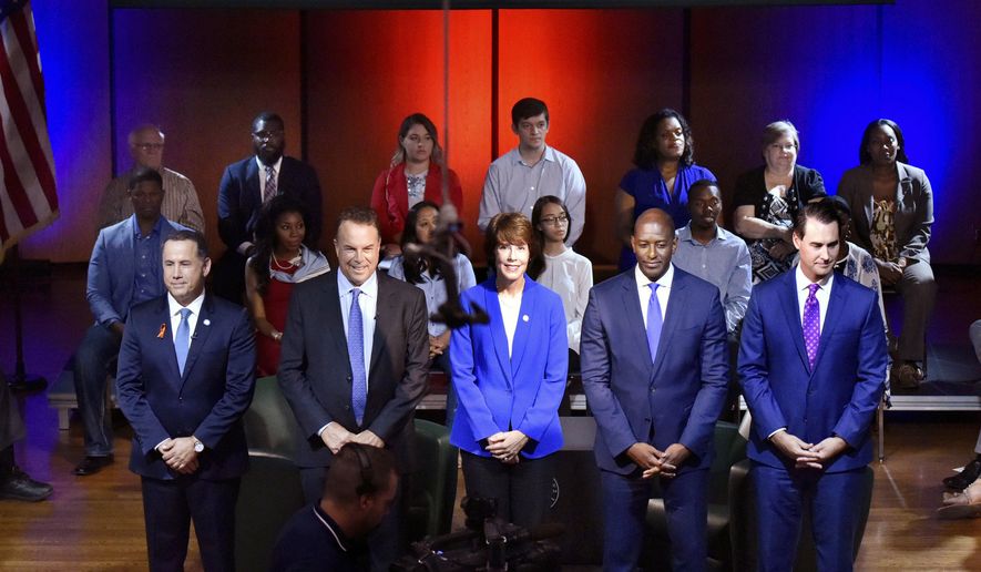 Florida Democratic gubernatorial candidates Philip Levine, from left, Jeff Greene, Gwen Graham, Andrew Gillum and Chris King take the stage before a town hall broadcast Thursday, August 9, 2018 at Jacksonville University in Jacksonville, Fla. (Will Dickey/The Florida Times-Union via AP)