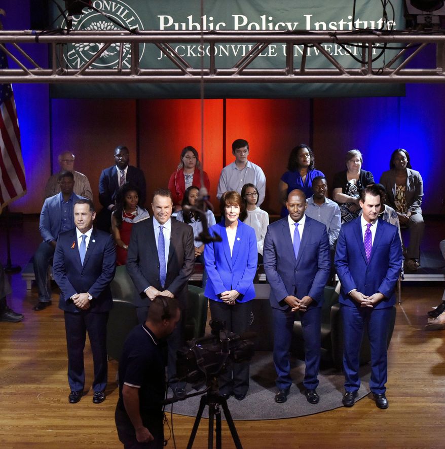 Florida Democratic gubernatorial candidates Philip Levine, from left, Jeff Greene, Gwen Graham, Andrew Gillum and Chris King take the stage before a town hall broadcast Thursday, August 9, 2018 at Jacksonville University in Jacksonville, Fla. (Will Dickey/The Florida Times-Union via AP)