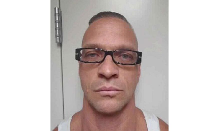 FILE - This undated file photo provided by Nevada Department of Corrections photo shows death row inmate Scott Raymond Dozier, who was convicted in 2007 of robbing, killing and dismembering a 22-year-old man in Las Vegas, and was convicted in Arizona in 2005 of another murder and dismemberment near Phoenix. Dozier whose execution has twice been postponed says Wednesday, Aug. 8, 2018, the legal fight over his fate is taking a tortuous toll on him and his family and he just wants his sentence carried out. (Nevada Department of Corrections via AP, File)