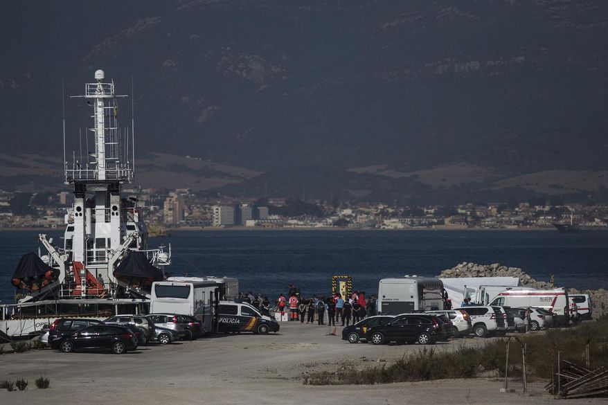 Migrants disembark from the Open Arms Search and Rescue vessel on arrival in Algeciras, Spain, Thursday, Aug. 9, 2018. A rescue boat operated by Spanish aid group Proactiva Open Arms carrying 87 African migrants and refugees saved in the Mediterranean Sea has docked at the southern Spanish port of Algeciras after other, geographically closer, European Union countries refused to let it dock amid continuing strain between governments about how to respond to the wave of migrants crossing from Africa. (AP Photo/Javier Fergo)
