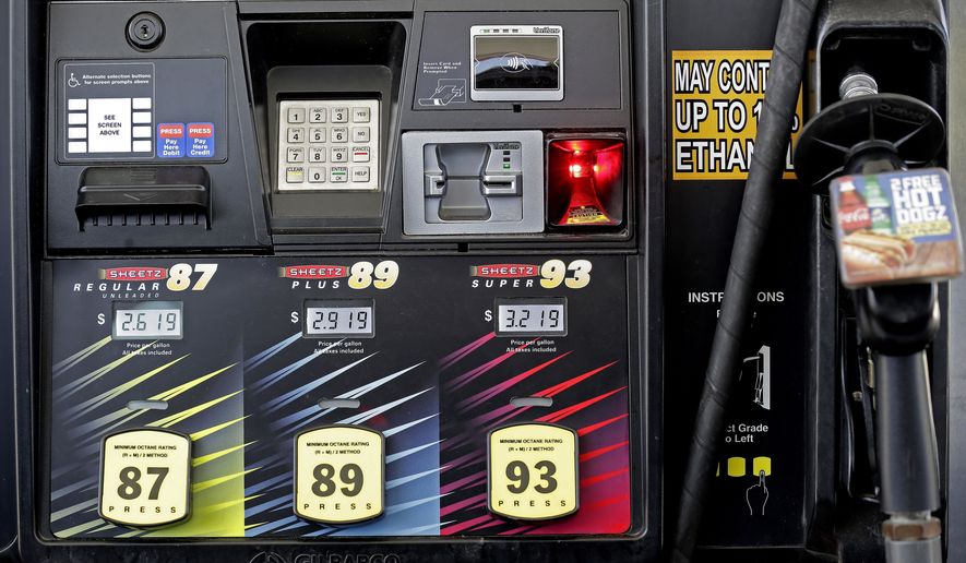 FILE- In this June 14, 2018, file photo,  gasoline prices are displayed on a pump at Sheetz along the Interstate 85 and 40 corridor near Burlington, N.C. On Friday, Aug. 10, the Labor Department reports on U.S. consumer prices for July. (AP Photo/Gerry Broome, File)