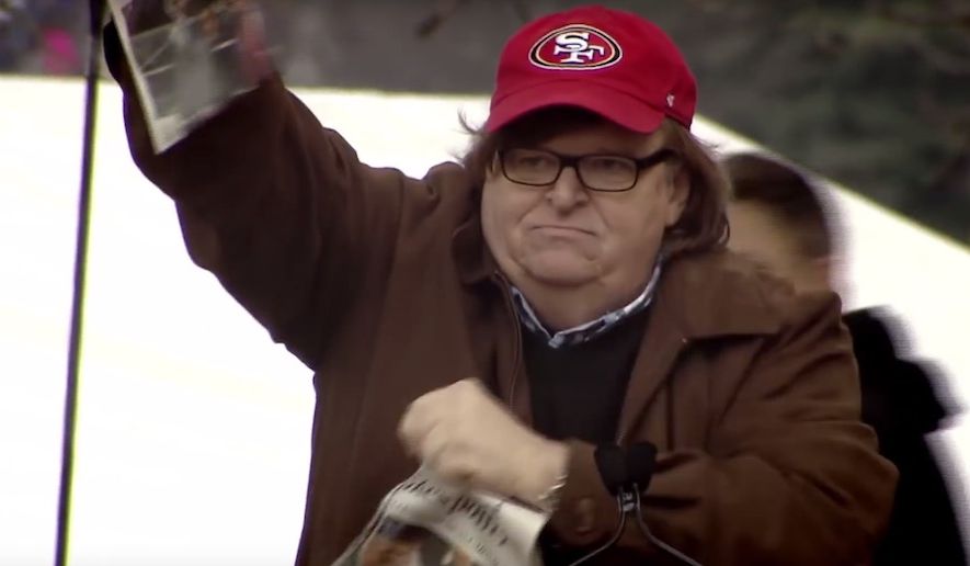 Filmmaker Michael Moore rips a newspaper with President Trump&#39;s visage on the front page during the trailer for his new &quot;Fahrenheit11/9&quot; documentary. (Image: YouTube, Michael Moore)   **FILE**