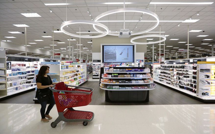 In this May 30, 2018, file photo, a shopper walks through the updated cosmetic department at a Target store in San Antonio. (AP Photo/Eric Gay, File)