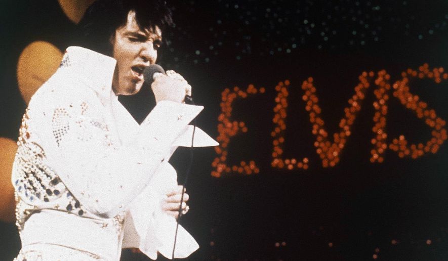 FILE - This 1972 file photo shows Elvis Presley, the King of Rock &#39;n&#39; Roll, during a performance. A launch party marking the release of an album of gospel songs by Presley is among the highlights of 2018’s Elvis Week in Memphis, Tenn. (AP Photo/File)