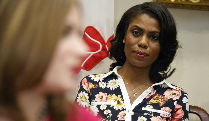 In this Feb. 14, 2017, file photo, Omarosa Manigault-Newman, then an aide to President Donald Trump, watches during a meeting with parents and teachers in the Roosevelt Room of the White House in Washington. The White House is slamming a new book by ex-staffer Omarosa Manigault-Newman, calling her “a disgruntled former White House employee.” (AP Photo/Evan Vucci, File)