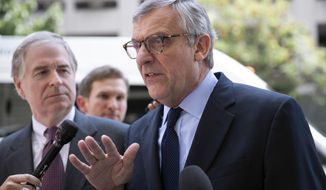 Paul Kamenar, attorney for Andrew Miller, joined by Peter Flaherty, chairman of the National Legal and Policy Center, left, talks to reporters after a federal judge found Miller in contempt for refusing to testify before the grand jury hearing evidence in special counsel Robert Mueller&#39;s investigation of Russian interference in the 2016 presidential election, at the District Court in Washington, Friday, Aug. 10, 2018. (AP Photo/J. Scott Applewhite)